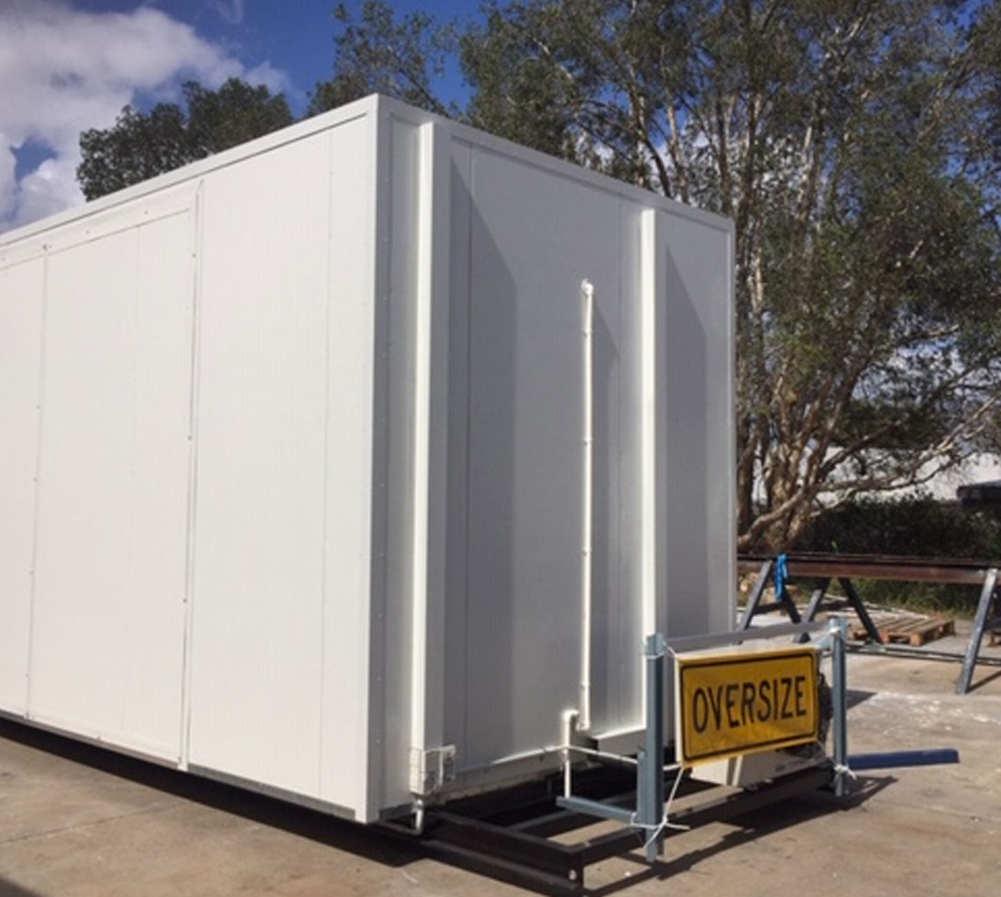 Mobile cold storage unit constructed with EPS sandwich panels, mounted on oversized transport frame